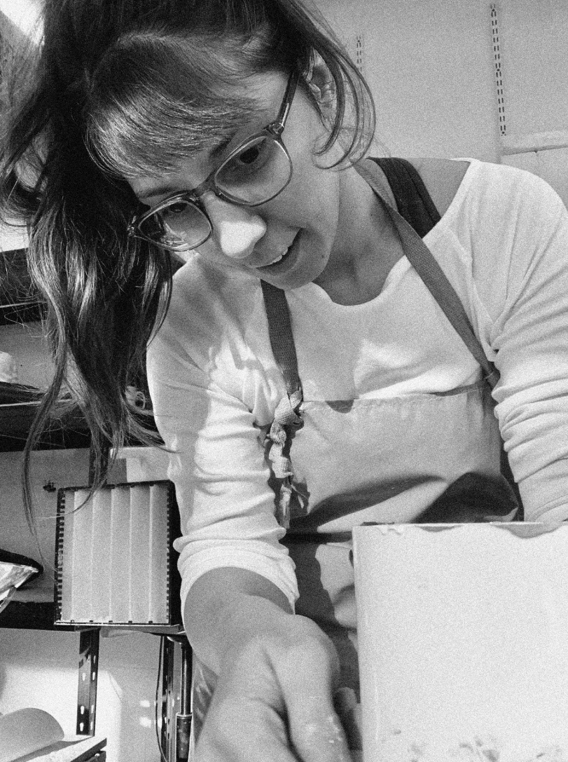 Rita, with a look of concentration on her face, hard at work creating a mould for her clap plates.